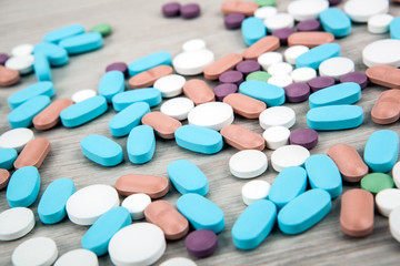 Fototapeta na wymiar many multi-colored medical pills close up