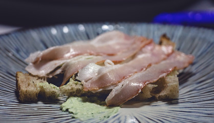 tasty gourmet dish with delicious bacon appetizer for a snack or dinner closeup