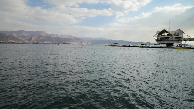 Pleasure boats, sailboats and yachts, view from the central beach of Eilat - famous resort and recreation city in Israel