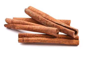 Cinnamon sticks on the white