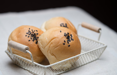 Sesame breads in wire mesh basket