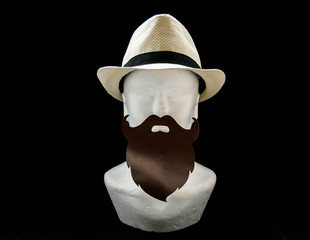 Styrofoam head with a straw male summer hat with black long moustache and beard on black background