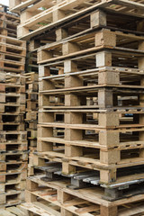 Pile of wooden pallets vertical close focus