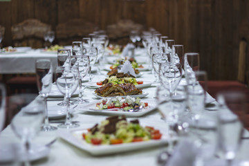 Neatly laid table, white tablecloth