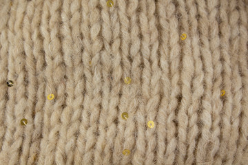 Cream knitted texture with gold sequins