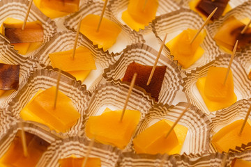 Canapes of cheese with fruits and marmalade, close-up shot