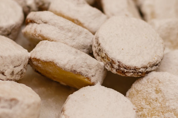 alfajores freshly baked cookies closeup on a plate on the table. horizontal