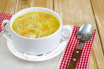 Chicken broth vermicelli on wooden table, dinne