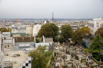 Paris, France - September 22, 2018: View of Eiffel tower and Batignolles cemetery from rooftop in Paris