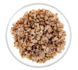 Buckwheat porridge in glass bowl isolated on white background