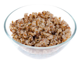 Buckwheat porridge in glass bowl isolated on white background