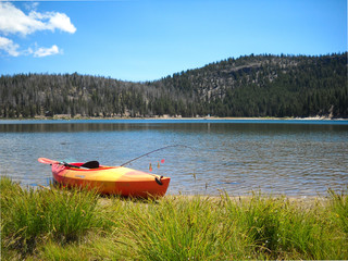 Kayak on high lake with fishing pole