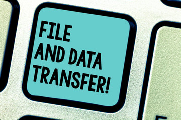Fototapeta premium Handwriting text writing File And Data Transfer. Concept meaning Transferring information online by the internet Keyboard key Intention to create computer message pressing keypad idea