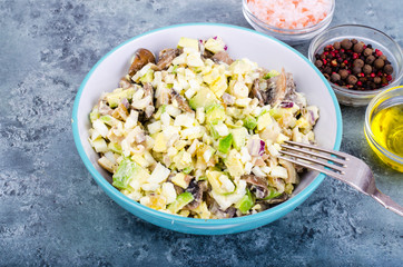 Healthy and dietary food. Salad with avocado, squid and egg