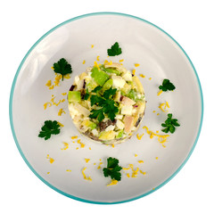 Salad with chicken and avocado on plate isolated on white background