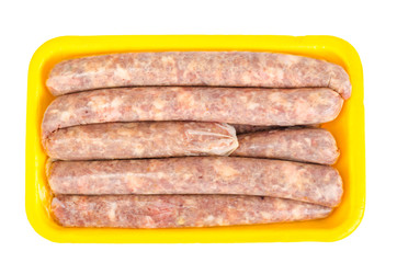 Raw homemade sausage in natural casing isolated on white background