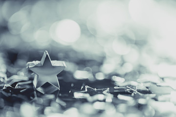 Macro photo of silver star with light bokeh
