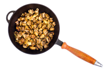 Cast iron pan, fried champignons with onions