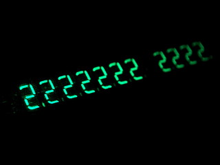 Green numbers in the dark. Old electronic numeric display. Hacking