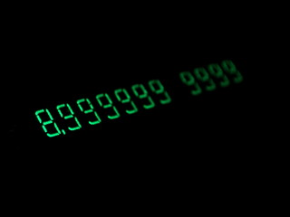 Green numbers in the dark. Old electronic numeric display. Hacking