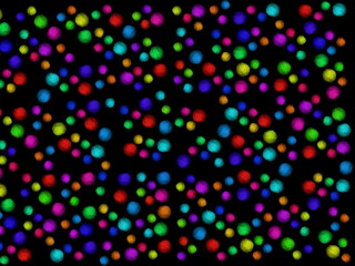 Multi-colored skeins of wool on a black background. Multicolored balls. Colored wool in the balls.