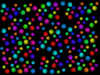 Multi-colored skeins of wool on a black background. Multicolored balls. Colored wool in the balls.