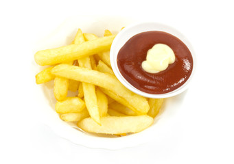 French Fries and tomato sauce in a white dish on a wood floor table, Top view with copy space for your text..