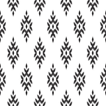 Ethnic seamless pattern. Boho ikat ornament. Can be used for textile, wallpaper, wrapping paper, greeting card background, phone case print. Black and white vector illustration. Tribal graphic design.