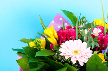 Elegant bouquet of flowers for celebration on blue background