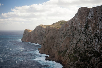 Fototapeta na wymiar Lighthouse and cliff rock at Cap de Formentor in Mallorca, Spain