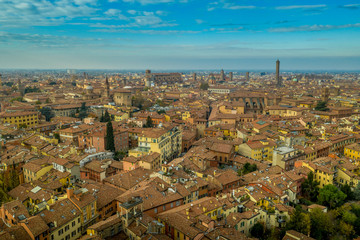 Obraz premium Aerial view of Bologna the capital city of Emilia Romagna province in Italy home to the best food and two leaning towers on a winter afternoon with sun set cloudy sky