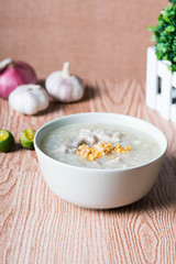 ox tripe congee or also known as goto best topped with fried garlic and calamansi juice