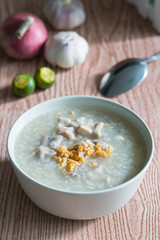 ox tripe congee or also known as goto best topped with fried garlic and calamansi juice