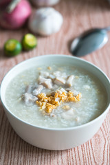 ox tripe congee or also known as goto best topped with fried garlic and calamansi juice