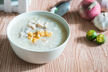 ox tripe congee or also known as goto best topped with fried garlic and calamansi juice