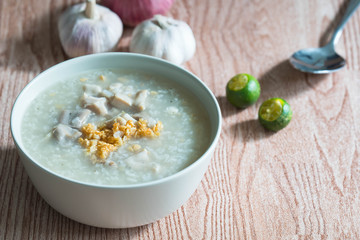 ox tripe congee or also known as goto best topped with fried garlic and calamansi juice