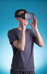 Young man using VR Virtual Reality headset