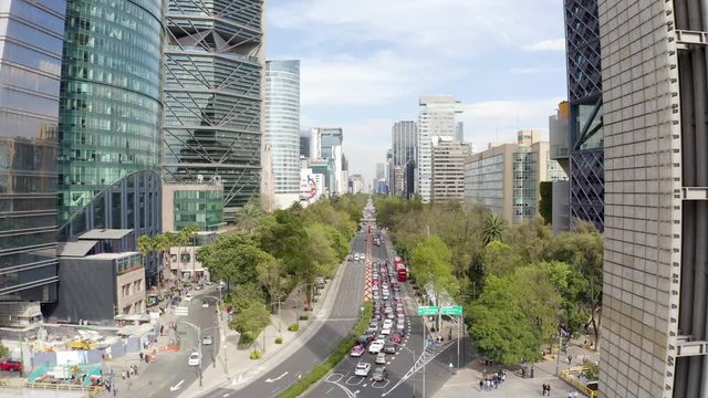 Mexico City Paseo De La Reforma Street 4k Aerial Drone Zoom In or Forward Movement of Skyscrapers in Business District on Main Street From Chapultepec Park