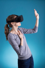Woman using VR Virtual Reality headset