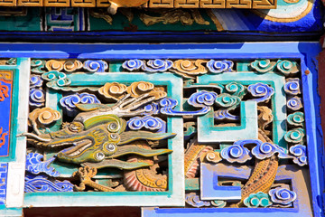 Coloured drawing or pattern wood carving in a temple