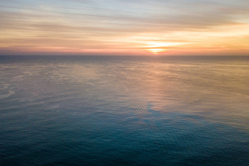 Sunrise over the ocean - Powered by Adobe