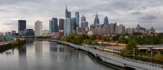 Fototapeta na wymiar Philadelphia, Pennsylvania, United States - October 28, 2018: Panoramic view of a modern Downtown City during a cloudy day.