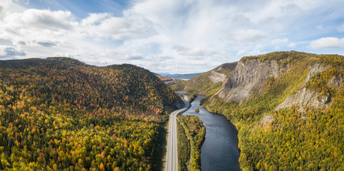 Aerial panoramic view of a scenic road during a vibrant sunny day. Taken near Corner Brook, Newfoundland, Canada.