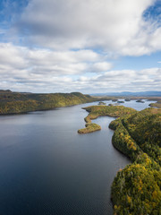 Obraz premium Aerial panoramic view of a beautiful lake during a vibrant sunny day. Taken in Newfoundland, Canada.