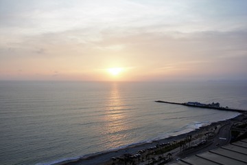 Fototapeta na wymiar the sun gets down on a beautifull evening on the Peruvian beach