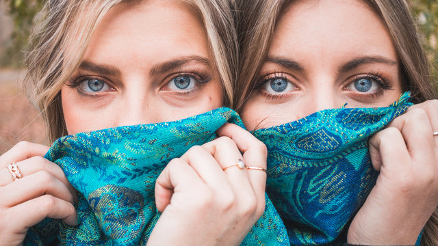 Closeup Of Gorgeous Blonde Women With Blue Eyes And Blue Scarf