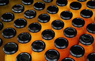 a series of bottles with juice in bright colors