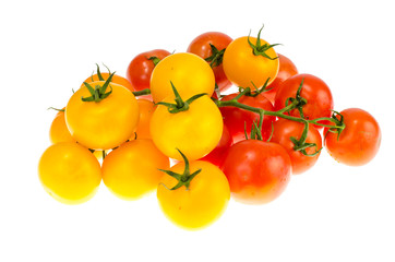 Yellow and red cherry tomatoes on white background