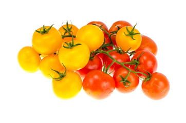Yellow and red cherry tomatoes on white background