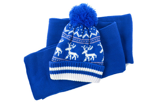 Blue knitted scarf winter bobble hat isolated white background